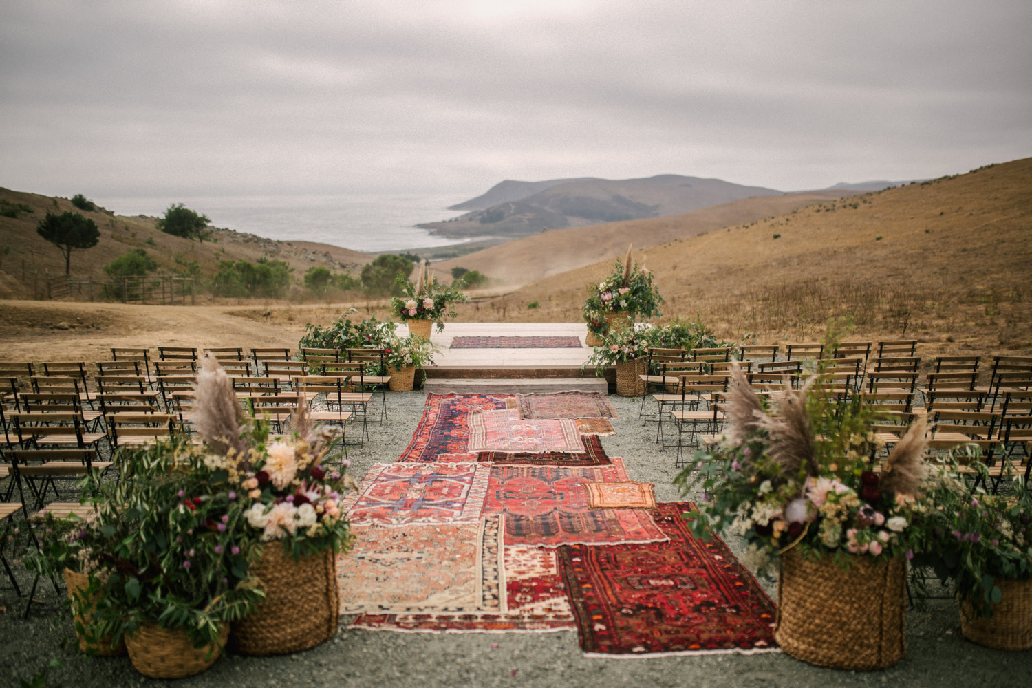 Layered_Vintage_Rug Oceanfront_Ceremony_at Swallow_Creek_Ranch